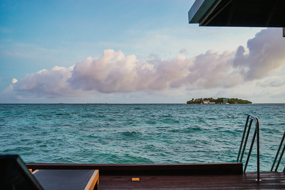 overwater bungalow balcony at the sheraton maldives full moon resort & spa