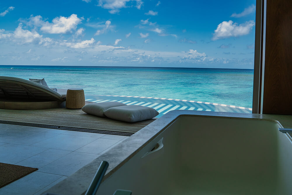ocean pool villa bathtub in ritz-carlton maldives, fari islands